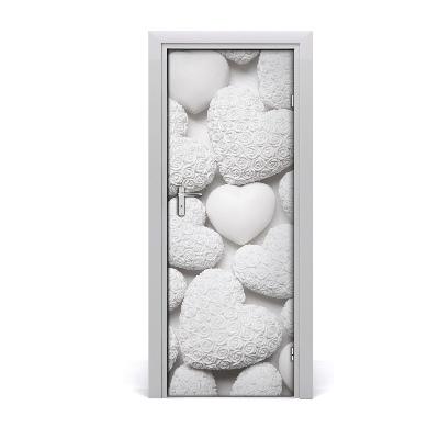 Naklejka fototapeta na drzwi Rozsypane białe serca tło