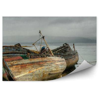 Okleina na ścianę Wraki stare łodzie woda pochmurne niebo