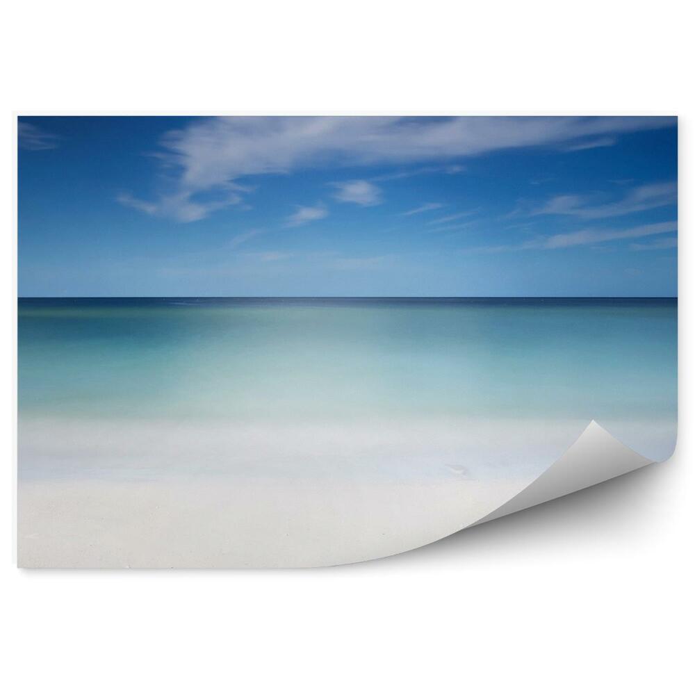 Fototapeta Piaszczysta plaża ocean niebo chmury