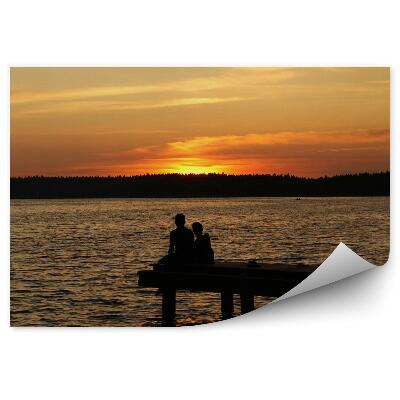 Fototapeta samoprzylepna Zachód słońca woda las molo