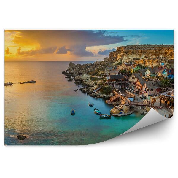 Fototapeta Panoramiczny widok budynki mosty schody łodzie skały zachód słońca