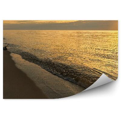 Okleina na ścianę Pomarańczowe światło słońca ślady stóp na piasku