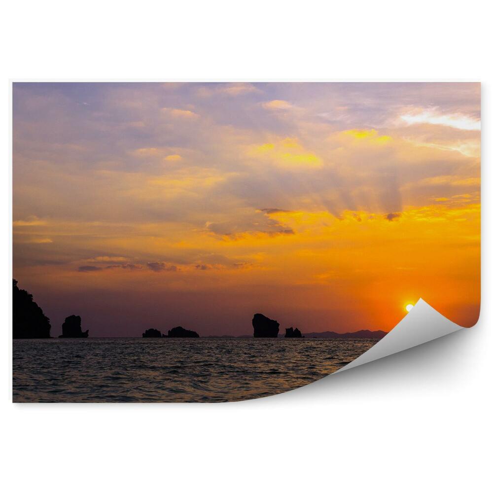 Fototapeta Zachód słońca skały ocean chmury