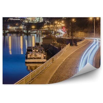 Fototapeta zamek drzewa budynki mosty droga łodzie rzeka niebo chmury Praga