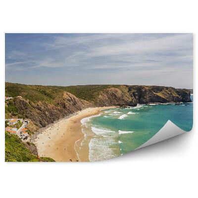 Fototapeta Wspaniała plaża arrifana budynki drzewa skały ocean fale