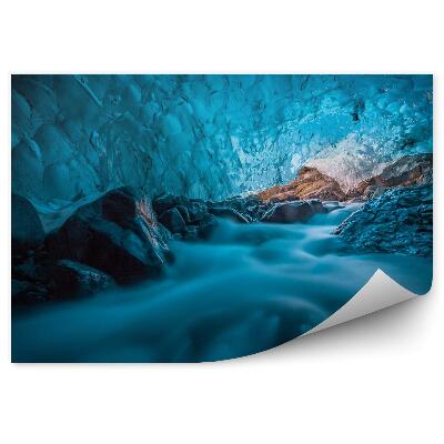 Fototapeta Grota di ghiaccio azzurro con ruscello sottostante islanda europa