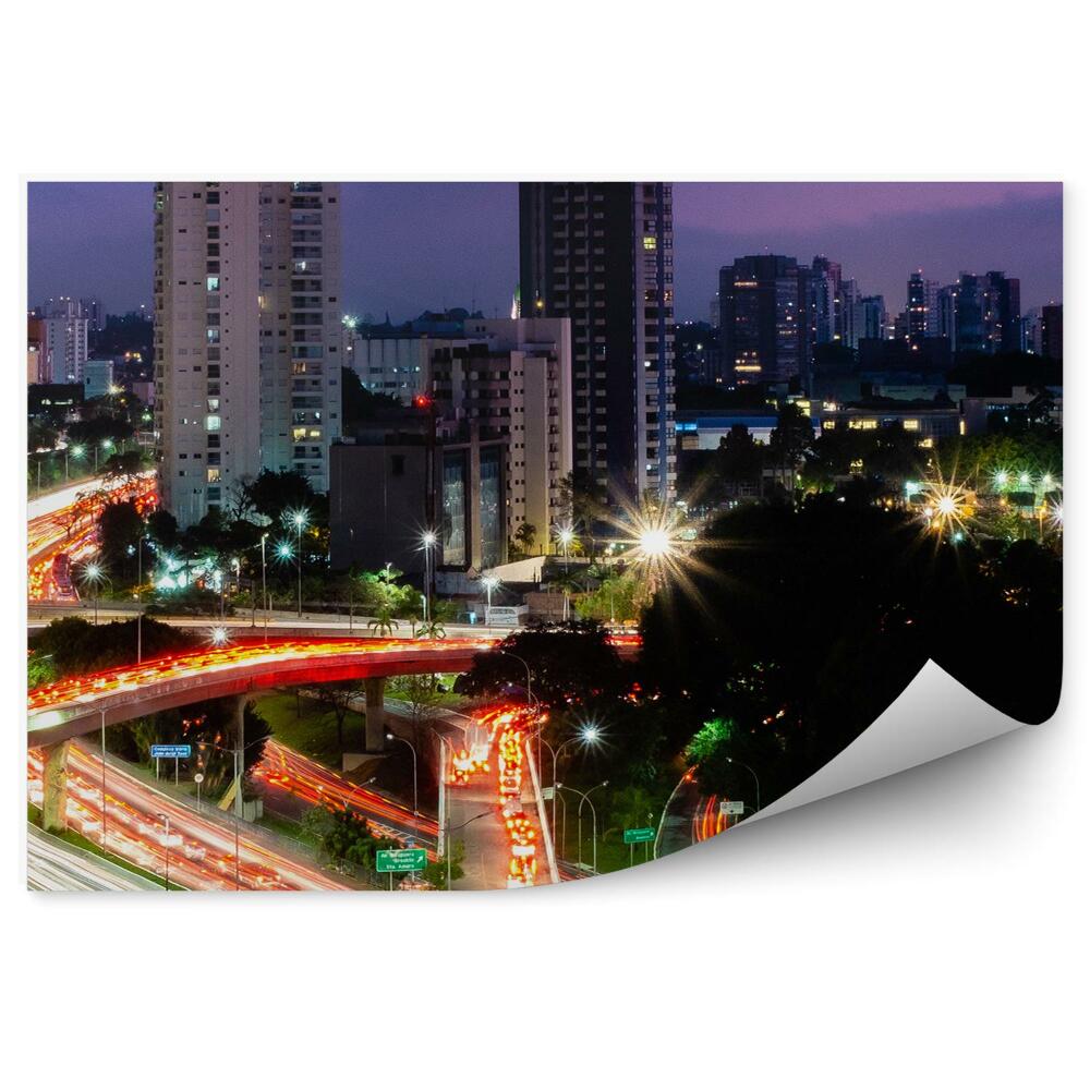 Fototapeta wieżowce drzewa ulica światła znaki drogowe