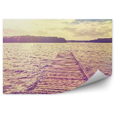 Fototapeta Pomost jezioro drzewa trawy niebo chmury zachód słońca